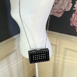 Black bag with silver metal details.